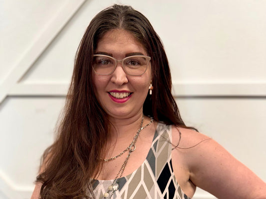 Photo of Jeni with white wood background. Jeni with diamond dress pattern, fair skin, and brown hair. aka miss glam girl