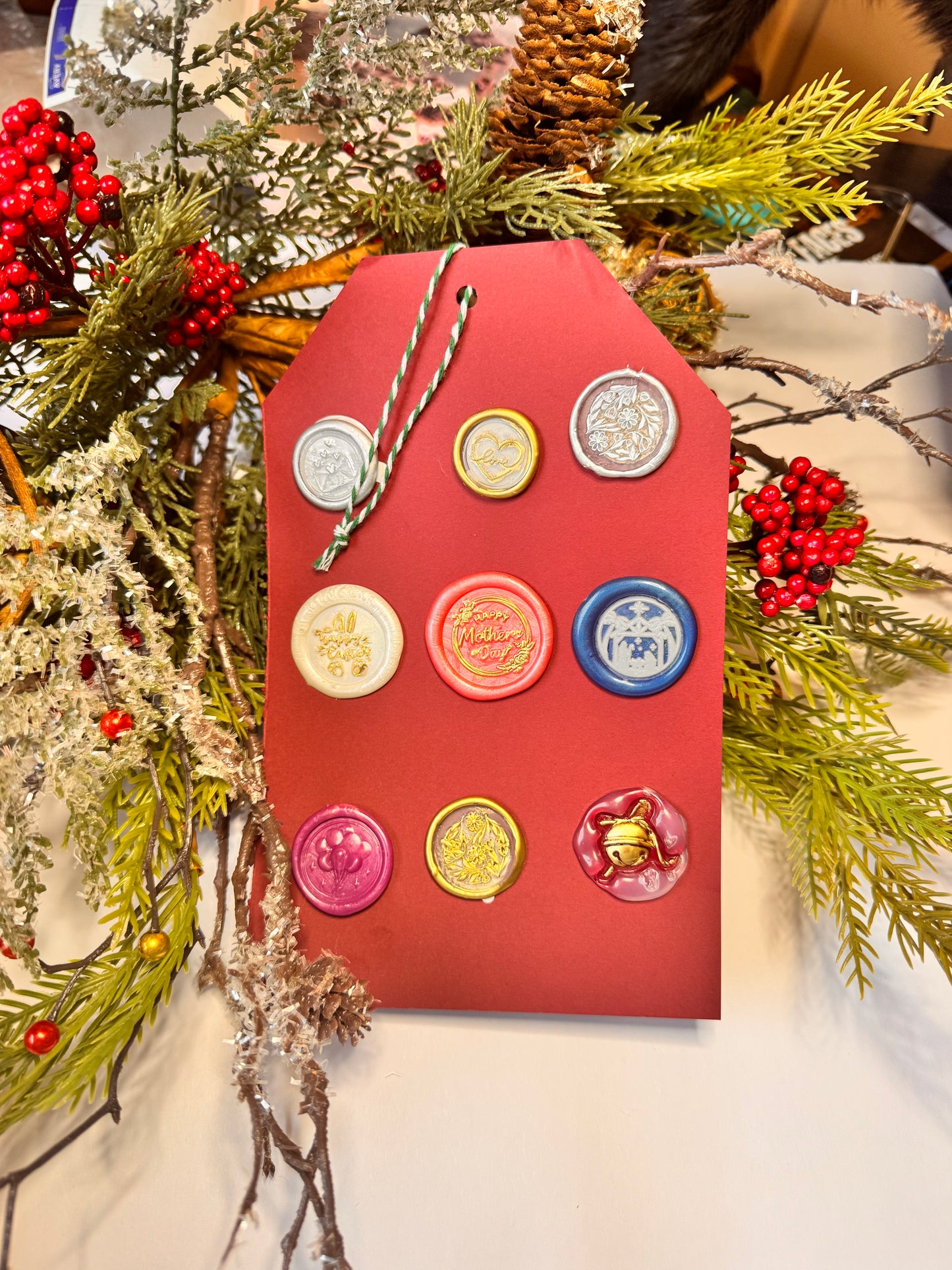 large gift tag with 9 wax seals to be used throughout the year including flowers, mothers day, easter, balloons, the Christmas Nativity, jingle bell.
