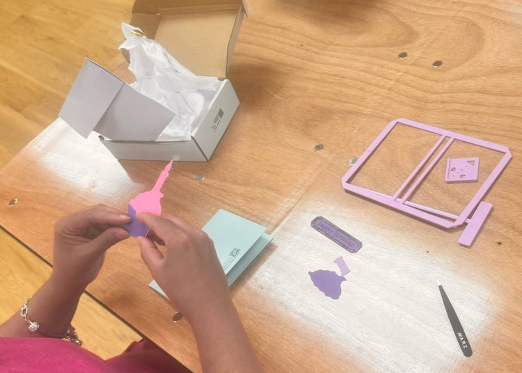 Tactile layers and textures guide placement an individual matches up cupcake pieces full piece with matching pieces to layer on top candle wraper frosting candle light