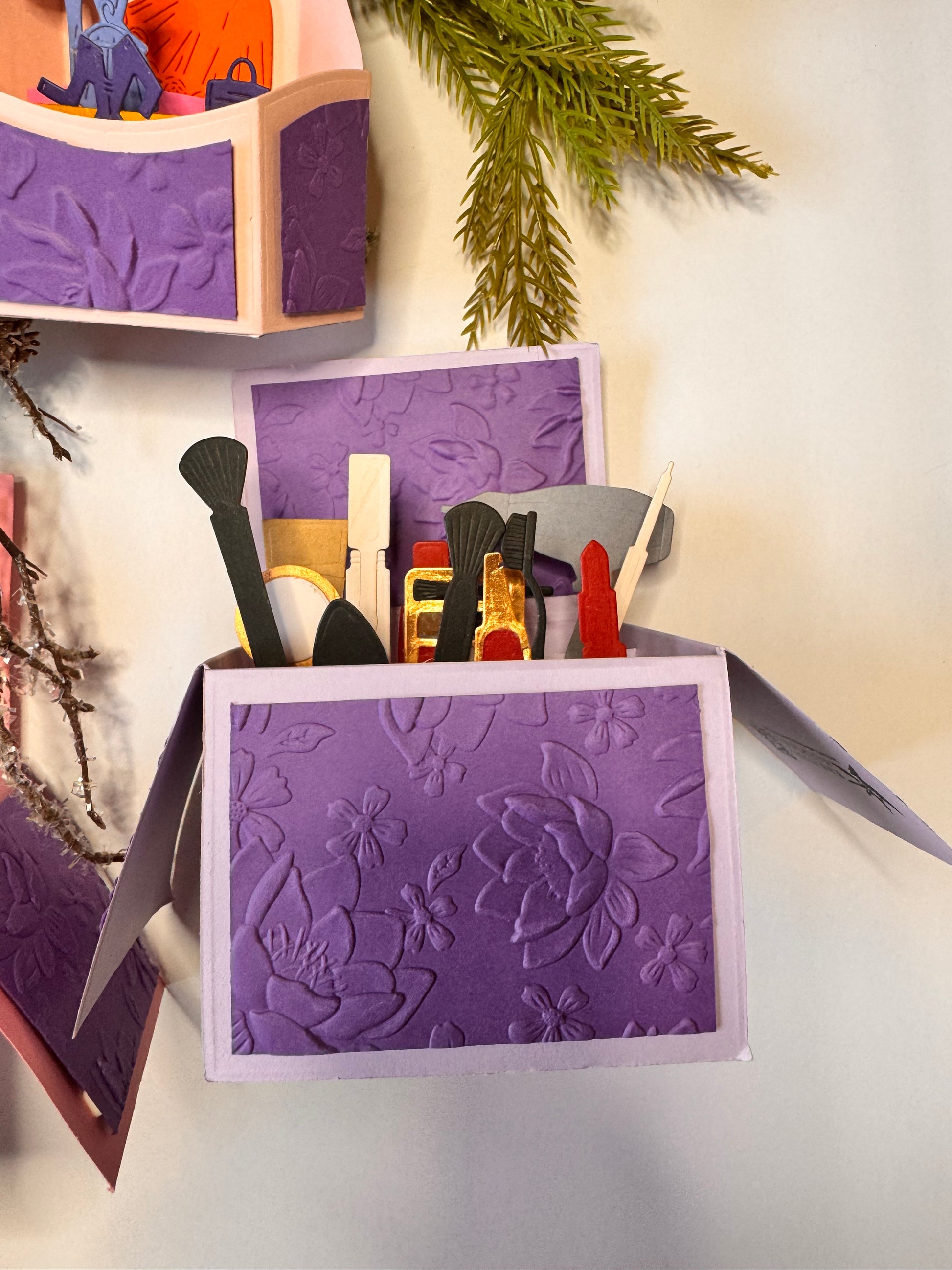  A makeup card including , and small nail polish, eye liner or lip liner, compact, blush brush, lipstick, hair dryer, liquid foundation brush, foundation, lip gloss and more. 