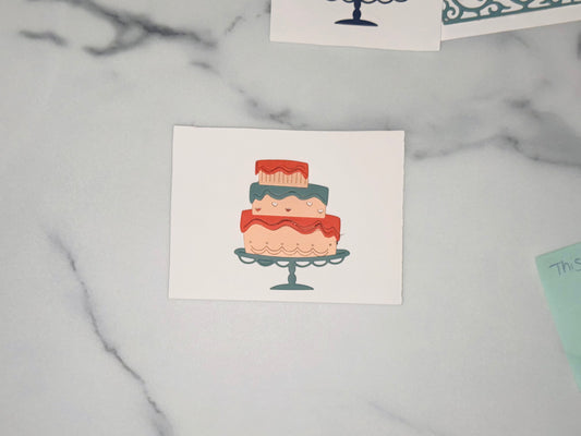 Top layer: small, beige cake with a red icing top that drips down in rounded points; a few thin vertical beige lines are drawn on the side. Middle layer: medium-sized, beige cake with a teal-blue icing band across the top edge; on the beige part are small heart shapes in white and red; the teal-blue band has a small white plus sign on the right side. Bottom layer: largest, beige cake with a red icing band across the top edge, drawn in wavy lines; along the lower part are repeating scalloped/loop designs out