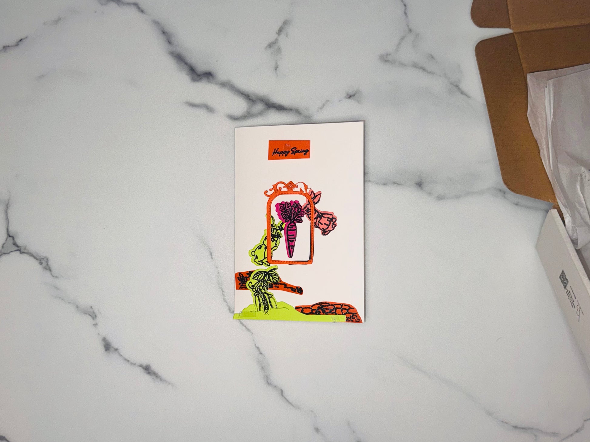 Happy Spring in black script, orange ornate- victorian arch-shaped frame, deep magenta carrot-, lime green male bunny, soft peach-pink bunny, lime green 3 peas growing or peas in a pod
