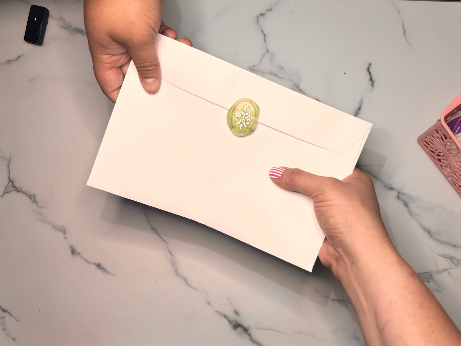 blindchild_is_giving_a_card_to_a_grandparent_centered_on_the_connection_and_touch_not_on_eye_contact.3